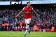 LONDON, ENGLAND - OCTOBER 19: Mesut Oezil of Arsenal celebrates as he scores their second goal during the Barclays Premier League match between Arsenal and Norwich City at Emirates Stadium on October 19, 2013 in London, England. (Photo by Paul Gilham/Ge