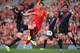 LIVERPOOL, ENGLAND - OCTOBER 05: Luis Suarez of Liverpool in action with Damien Delaney and Mile Jedinak of Crystal Palace during the Barclays Premier League match between Liverpool and Crystal Palace at Anfield on October 5, 2013 in Liverpool, England.