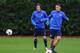 ST ALBANS, ENGLAND - OCTOBER 21: Mesut Oezil (R) and Tomas Rosicky of Arsenal in action during an Arsenal training session ahead of the UEFA Champions League Group F match against Borussia Dortmund at London Colney on October 21, 2013 in St Albans, Engla