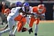 Oct 19, 2013; Stillwater, OK, USA; Oklahoma State Cowboys quarterback Clint Chelf (10) rushes up field against Texas Christian Horned Frogs defensive back Jason Verrett (2) during the second half at Boone Pickens Stadium. Oklahoma State won 24-10. Mandato