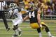 IOWA CITY, IOWA - OCTOBER 5: Wide receiver Macgarrett Kings Jr. #3 of the Michigan State Spartans rushes up field during the first quarter past linebacker James Morris #44 of the Iowa Hawkeyes on October 5, 2013 at Kinnick Stadium in Iowa City, Iowa. Mic