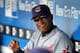 KANSAS CITY, MO - MAY 13: First base coach Sandy Alomar, Jr. #15 of the Cleveland Indians watches from the dugout prior to the game against the Kansas City Royals on May 13, 2010 at Kauffman Stadium in Kansas City, Missouri. (Photo by Jamie Squire/Getty