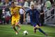 DONETSK, UKRAINE - JUNE 15: Karim Benzema of France and Andriy Yarmolenko of Ukraine compete for the ball during the UEFA EURO 2012 group D match between Ukraine and France at Donbass Arena on June 15, 2012 in Donetsk, Ukraine. (Photo by Lars Baron/Gett