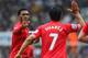NEWCASTLE UPON TYNE, ENGLAND - OCTOBER 19: Daniel Sturridge of Liverpool high fives Luis Suarez of Liverpool during the Barclays Premier League match between Newcastle United and Liverpool at St James' Park on October 19, 2013 in Newcastle upon Tyne, Eng