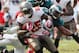 Oct 13, 2013; Tampa, FL, USA; Tampa Bay Buccaneers running back Mike James (25) runs with the ball as Philadelphia Eagles free safety Earl Wolff (28) and inside linebacker DeMeco Ryans (59) tackle during the second half at Raymond James Stadium. Philadelp