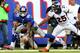 EAST RUTHERFORD, NJ - SEPTEMBER 15: Victor Cruz #80 of the New York Giants drops this pass in the second quarter as Chris Harris #25 of the Denver Broncos defends at MetLife Stadium on September 15, 2013 in East Rutherford, New Jersey. (Photo by Elsa/G