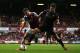 LONDON, ENGLAND - OCTOBER 19: Ravel Morrison of West Ham is tackled by Sergio Aguero of Manchester City during the Barclays Premier League match between West Ham United and Manchester City at Boleyn Ground on October 19, 2013 in London, England. (Photo