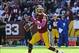 Oct 20, 2013; Landover, MD, USA; Washington Redskins quarterback Robert Griffin III (10) rolls out against the Chicago Bears during the first half at FedEX Field. Mandatory Credit: Brad Mills-USA TODAY Sports