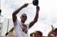 Jun 24, 2013; Miami, FL, USA; `Miami Heat small forward Shane Battier bangs on a pot during the Miami Heat Championship celebration parade in downtown Miami. Mandatory Credit: Robert Mayer-USA TODAY Sports