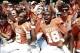 Oct 12, 2013; Dallas, TX, USA; Texas Longhorns wide receiver Kendall Sanders (2) and quarterback Tyrone Swoopes (18) celebrate with fans after beating Oklahoma Sooners in the Red River Rivalry at Cotton Bowl Stadium. The Texas Longhorns beat the Oklahoma
