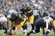 Oct 20, 2013; Pittsburgh, PA, USA; Pittsburgh Steelers quarterback Ben Roethlisberger (7) waits for the snap from center Fernando Velasco (61) against the Baltimore Ravens during the first quarter at Heinz Field. The Steelers won 19-16. Mandatory Credit: