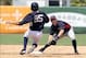 March 23, 2012; Tampa, FL, USA; Minnesota Twins shortstop Brian Dozier (77) forces out New York Yankees outfielder Mason Williams (85) in the seventh inning at George M. Steinbrenner Field. Mandatory Credit: Kim Klement-USA TODAY Sports