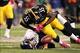 Oct 20, 2013; Pittsburgh, PA, USA; Pittsburgh Steelers linebacker Stevenson Sylvester (55) hits Baltimore Ravens kicker Justin Tucker (9) after an attempted onside kick during the second half at Heinz Field. The Steelers won the game, 19-16. Mandatory Cre