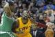 Jan 22, 2013; Cleveland, OH, USA; Cleveland Cavaliers point guard Kyrie Irving (2) loses his protective face mask while fouled by Boston Celtics point guard Rajon Rondo (9) in the third quarter at Quicken Loans Arena. Mandatory Credit: David Richard-USA T
