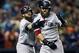 Oct 17, 2013; Detroit, MI, USA; Boston Red Sox first baseman Mike Napoli (12) celebrates his home run with left fielder Jonny Gomes (right) against the Detroit Tigers during the second inning in game five of the American League Championship Series baseba