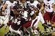 Sep 21, 2013; Starkville, MS, USA; Troy Trojans running back Jordan Chunn (36) carries the ball and is tackled by Mississippi State Bulldogs defensive lineman Curtis Virges (98) , defensive lineman Nelson Adams (94) and linebacker Zach Jackson (14) at D