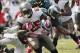 Oct 13, 2013; Tampa, FL, USA; Tampa Bay Buccaneers running back Mike James (25) runs with the ball as Philadelphia Eagles free safety Earl Wolff (28) and inside linebacker DeMeco Ryans (59) tackle during the second half at Raymond James Stadium. Philadelp