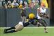 Oct 20, 2013; Green Bay, WI, USA; Cleveland Browns running back Fozzy Whittaker (35) is tackled by Green Bay Packers linebacker Jamari Lattimore (57) in the 4th quarter at Lambeau Field. Mandatory Credit: Benny Sieu-USA TODAY Sports