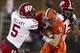 Oct 19, 2013; Champaign, IL, USA; Illinois Fighting Illini wide receiver Steve Hull (9) is tackled by Wisconsin Badgers cornerback Darius Hillary (5) and safety Dezmen Southward (12) in the first half at Memorial Stadium. Mandatory Credit: Trevor Ruszkow