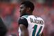 Oct 13, 2013; Denver, CO, USA; Jacksonville Jaguars wide receiver Justin Blackmon (14) on the sidelines in the fourth quarter against the Denver Broncos at Sports Authority Field at Mile High. The Broncos defeated the Jaguars 35-19. Mandatory Credit: Ron