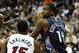 Oct 11, 2013; Kansas City, MO, USA; Charlotte Bobcats small forward Michael Kidd-Gilchrist (14) looks to pass against Miami Heat point guard Mario Chalmers (15) in the first half at Sprint Center. Mandatory Credit: John Rieger-USA TODAY Sports
