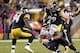 Oct 20, 2013; Pittsburgh, PA, USA; Baltimore Ravens running back Ray Rice (27) carries the ball as Pittsburgh Steelers inside linebacker Lawrence Timmons (94) and defensive end Brett Keisel (99) defend during the fourth quarter at Heinz Field. The Steeler