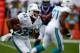 Oct 20, 2013; Miami Gardens, FL, USA; Miami Dolphins running back Daniel Thomas (33) runs with the ball in the first quarter of a game against the Buffalo Bills at Sun Life Stadium. Mandatory Credit: Robert Mayer-USA TODAY Sports