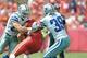 Sep 15, 2013; Kansas City, MO, USA; Kansas City Chiefs tight end Sean McGrath (84) is tackled by Dallas Cowboys middle linebacker Sean Lee (50) and cornerback Brandon Carr (39) during the first half at Arrowhead Stadium. Mandatory Credit: Denny Medley-USA