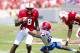 August 31, 2013; Raleigh, NC, USA; North Carolina State quarterback Brandon Mitchell (8) runs with the ball before being tackled by the Louisiana Tech defensive back Kentrell Brice (23) during the 1st quarter at Carter Finley Stadium. Mandatory Credit: