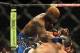 Jul 27, 2013; Seattle, WA, USA; Mac Danzig (red tape) is beaten by Melvin Guillard (blue tape) during their lightweight bout at Key Arena. Guillard won by TKO in 2nd Round. Mandatory Credit: Jayne Kamin-Oncea-USA TODAY Sports