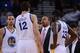 October 24, 2013; Oakland, CA, USA; Golden State Warriors head coach Mark Jackson (second from right) instructs point guard Stephen Curry (30), center Andrew Bogut (12), and small forward Draymond Green (23) during the fourth quarter against the Portland
