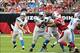 Detroit Lions guard Larry Warford keeps quarterback Matthew Stafford clean.