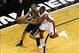 Jun 20, 2013; Miami, FL, USA; Miami Heat point guard Mario Chalmers (15) attempts a steal against San Antonio Spurs point guard Tony Parker (9) during the first quarter of game seven in the 2013 NBA Finals at American Airlines Arena. Mandatory Credit: Rob