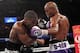 Mar 9, 2013; Brooklyn, NY, USA; Tavoris Cloud (tiger trunks) and Bernard Hopkins (purple/silver trunks) trade punches during their IBF light heavyweight title bout at the Barclay's Center. Mandatory Credit: Ed Mulholland-USA TODAY Sports