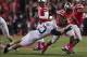 Oct 26, 2013; Columbus, OH, USA; Ohio State Buckeyes running back Carlos Hyde (34) pulls away from Penn State Nittany Lions safety Ryan Keiser (23) at Ohio Stadium. Mandatory Credit: Greg Bartram-USA TODAY Sports