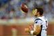 Aug 22, 2013; Detroit, MI, USA; New England Patriots quarterback Tim Tebow (5) on the sidelines in the fourth quarter of a preseason game against the Detroit Lions at Ford Field. Mandatory Credit: Andrew Weber-USA TODAY Sports