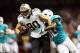 Sep 30, 2013; New Orleans, LA, USA; New Orleans Saints tight end Jimmy Graham (80) fights off Miami Dolphins strong safety Chris Clemons (30) on his way to scoring a touchdown in the third quarter at Mercedes-Benz Superdome. Mandatory Credit: Crystal LoGi