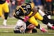 Oct 20, 2013; Pittsburgh, PA, USA; Pittsburgh Steelers linebacker Stevenson Sylvester (55) hits Baltimore Ravens kicker Justin Tucker (9) after an attempted onside kick during the second half at Heinz Field. The Steelers won the game, 19-16. Mandatory Cre