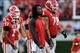 Sep 28, 2013; Athens, GA, USA; Georgia Bulldogs running back Todd Gurley (center without jersey) shown on the sideline after leaving the game with an injury during the second half at Sanford Stadium. Georgia defeated LSU 44-41. Mandatory Credit: Dale Zani