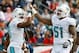 Oct 27, 2013; Foxborough, MA, USA; Miami Dolphins wide receiver Brandon Gibson (10) celebrates a touchdown reception with center Mike Pouncey (51) during the first quarter against the New England Patriots at Gillette Stadium. Mandatory Credit: Stew Milne