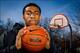 Apr. 5, 2013; Chicago, IL, USA; Simeon Career Academy varsity basketball team member Jabari Parker poses on an outdoor court near the school on the south side of Chicago. Parker, a 6 foot 8 inch senior, has verbally committed to attending Duke University