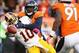 Oct 27, 2013; Denver, CO, USA; Washington Redskins quarterback Robert Griffin III (10) throws the ball away as he's hit by Denver Broncos linebacker Von Miller (58) during the second half at Sports Authority Field at Mile High. The Broncos won 45-21. Mand
