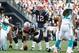 Oct 27, 2013; Foxborough, MA, USA; New England Patriots quarterback Tom Brady (12) at the line of scrimmage against the Miami Dolphins during the fourth quarter at Gillette Stadium. The Patriots defeated the Dolphins 27-17. Mandatory Credit: Stew Milne-US