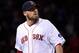 Oct 24, 2013; Boston, MA, USA; Boston Red Sox starting pitcher John Lackey walks back to the dugout after retiring the St. Louis Cardinals in the fifth inning during game two of the MLB baseball World Series at Fenway Park. Mandatory Credit: Robert Deutsc