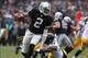 Oct 27, 2013; Oakland, CA, USA; Oakland Raiders quarterback Terrelle Pryor (2) elects to run ahead of Pittsburgh Steelers cornerback Ike Taylor (24) during the third quarter at O.co Coliseum. The Oakland Raiders defeated the Pittsburgh Steelers 21-18. Man