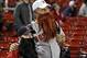 Oct 23, 2013; Boston, MA, USA; Boston Red Sox fans Hayden Moses (left) and Brian Moses (right) watch warm ups before game one of the MLB baseball World Series against the St. Louis Cardinals at Fenway Park. Mandatory Credit: Robert Deutsch-USA TODAY Sport