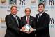 May 21, 2013; New York, NY, USA; New York Yankees president Randy Levine (left) , Major League Soccer commissioner Don Garber (middle) and Manchester City FC chief executive officer Ferran Soriano pose for a photo after announcing the formation of the New