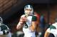 Oct 26, 2013; Champaign, IL, USA; Michigan State Spartans quarterback Connor Cook (18) drops back to pass during the first half against the Michigan State Spartans at Memorial Stadium. Mandatory Credit: Pat Lovell-USA TODAY Sports