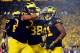 Sep 7, 2013; Ann Arbor, MI, USA; Michigan Wolverines wide receiver Jeremy Gallon (21) celebrates with teammates after scoring a touchdown during the third quarter against the Notre Dame Fighting Irish at Michigan Stadium. Mandatory Credit: Andrew Weber-US