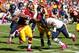 Oct 20, 2013; Landover, MD, USA; Washington Redskins running back Alfred Morris (46) carries the ball as Chicago Bears outside linebacker Lance Briggs (55) dives to make the tackle in the first quarter at FedEx Field. Cutler was injured on the play. Manda